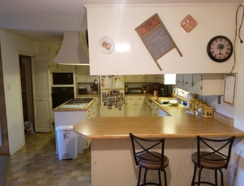 Kitchen before remodel: dated cabinets and laminate counters