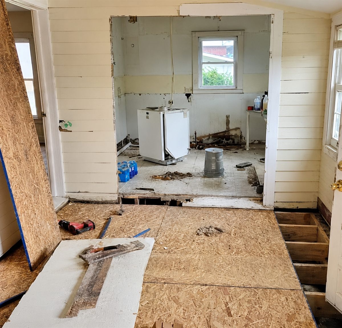 Kitchen demoed to the subfloor during restoration work